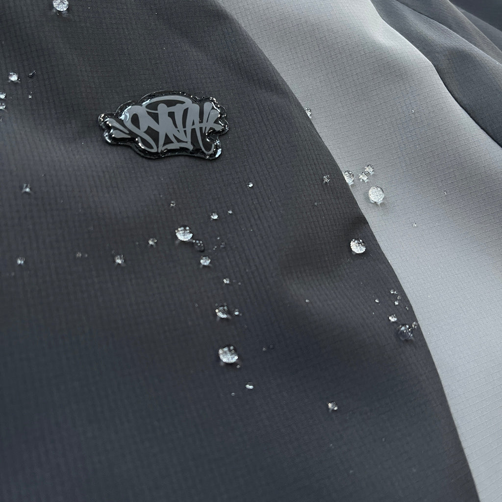 SYNA VORTEX WOVEN JACKET (BLACKOUT)