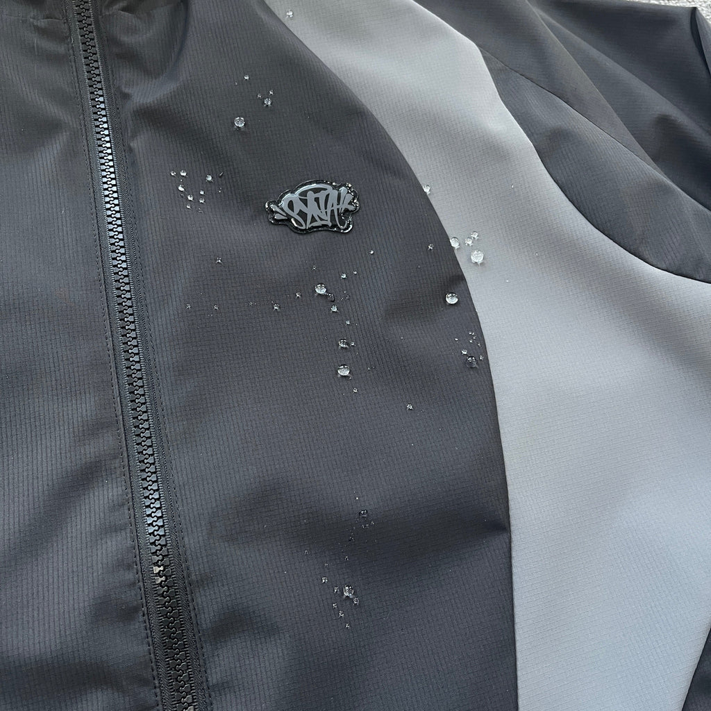 SYNA VORTEX WOVEN JACKET (BLACKOUT)